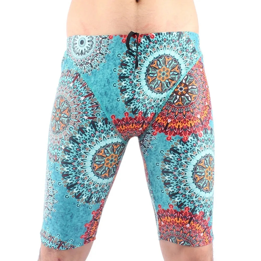 Green and navy blue men's loose-fit swimming trunks with a five-point design and polyester lining.