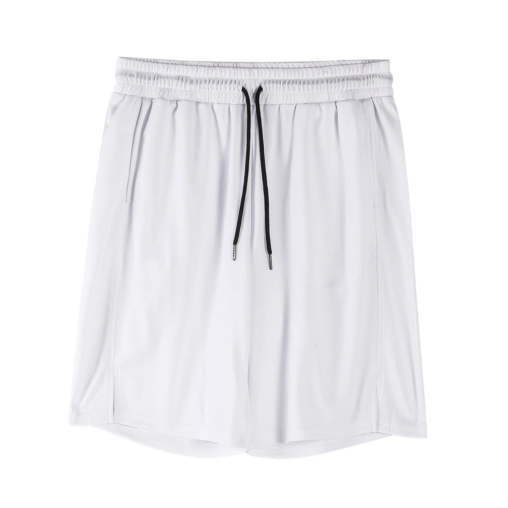A man wearing loose-fitting black quick-dry mesh fitness shorts with an elastic waist.