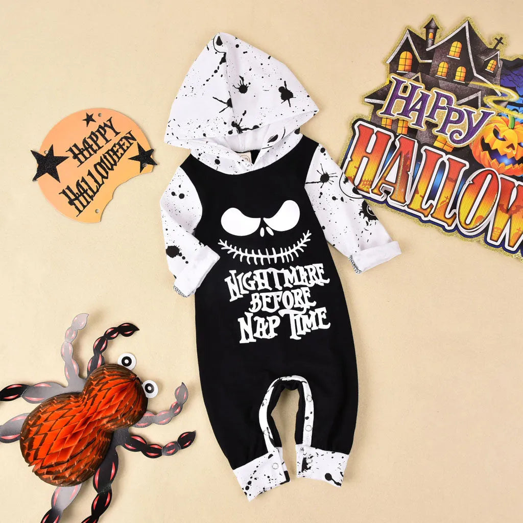 Halloween romper in black cotton with long sleeves and attached hood, shown on a neutral mannequin