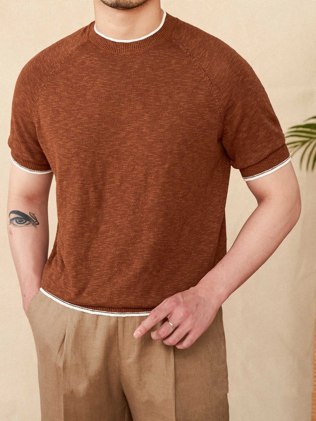 Brown linen cotton casual t-shirt with round neck and short sleeves on hanger