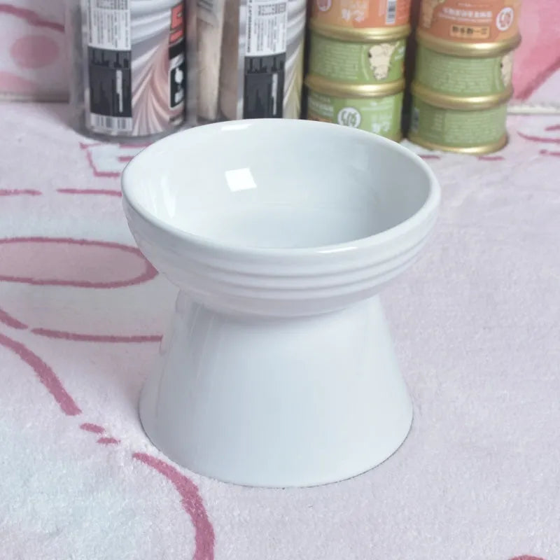 Black ceramic pet bowl with a high foot and neck protector to prevent tipping, shown with flat and slanted rim options.
