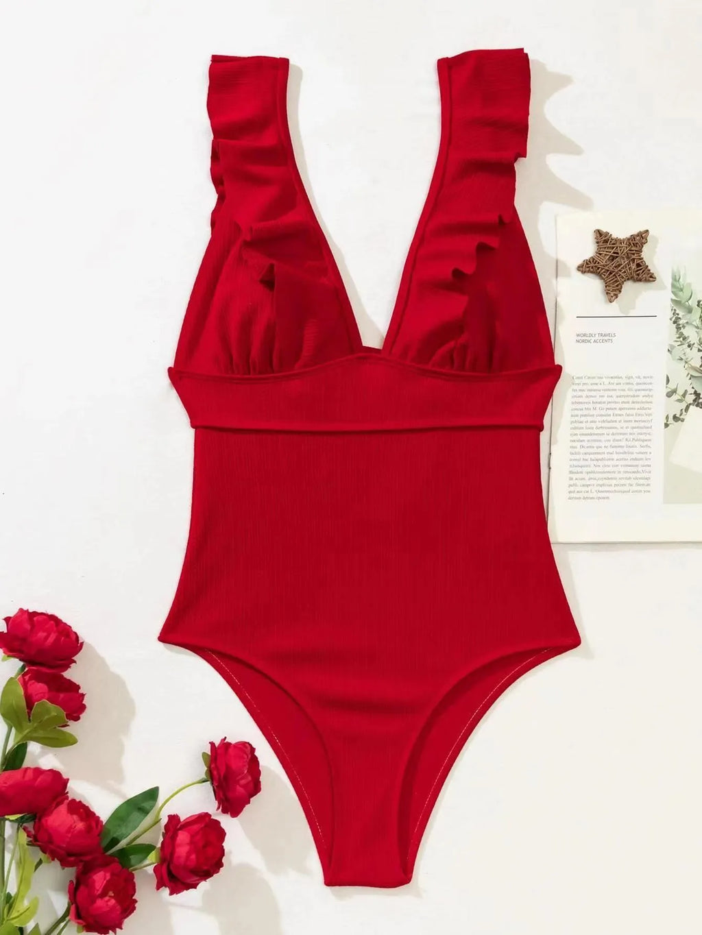 Women's black one-piece swimsuit with ruffled shoulder straps and lace-up back.