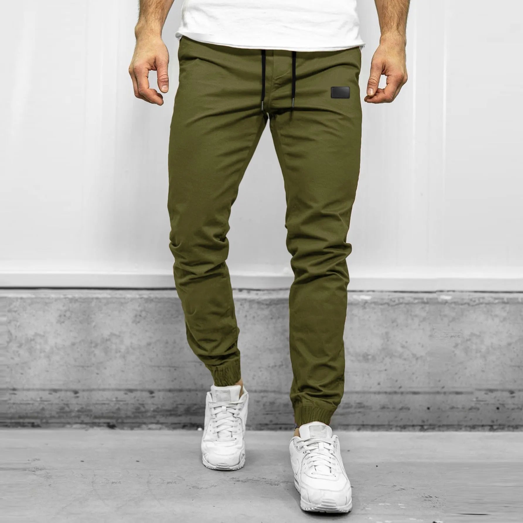 Loose fit quick-dry running trousers in polyester nylon blend, available in four colours and sizes M to XXXL