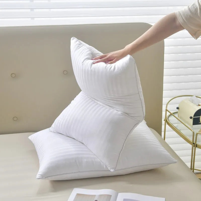 White hotel cotton satin stripe feather and cotton pillow showing size options.