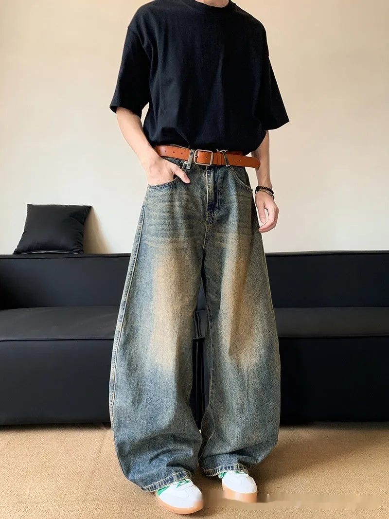 Men's retro blue distressed denim jeans with machete detailing and wide-leg fit
