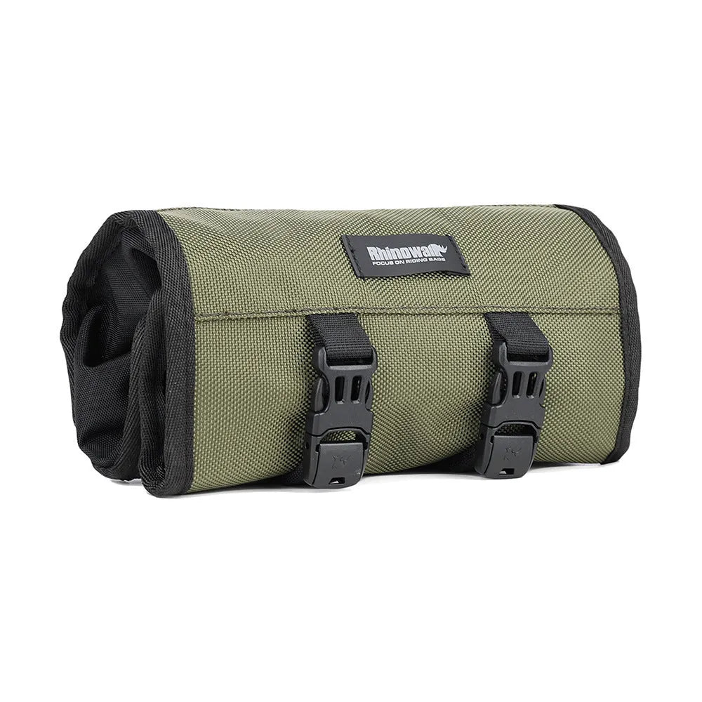 Motorcycle repair tool roll laid flat in black polyester with elastic straps and mesh zipper pocket