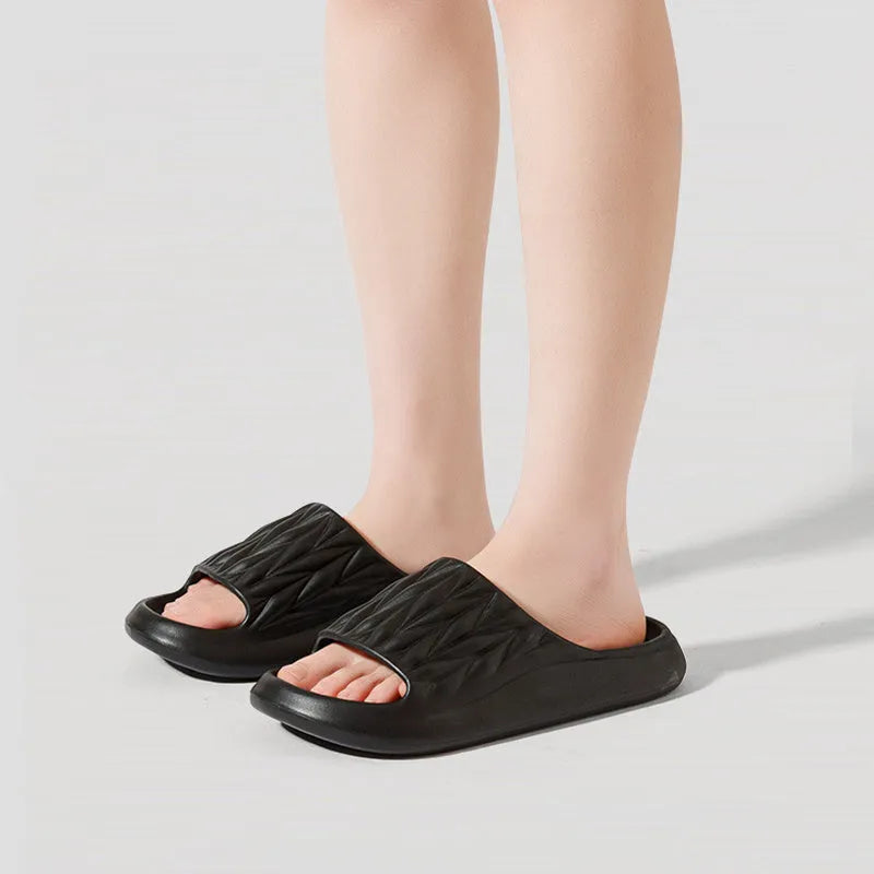 Leaf texture design EVA slippers for indoor summer and bathroom use.