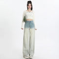 Women's gradient blue straight-leg denim trousers with wide leg style on hanger