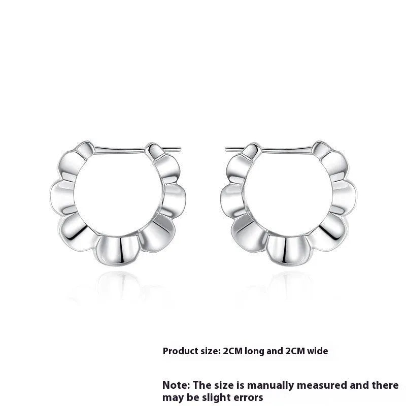 A pair of sterling silver retro geometric earrings with round elements and electroplating.