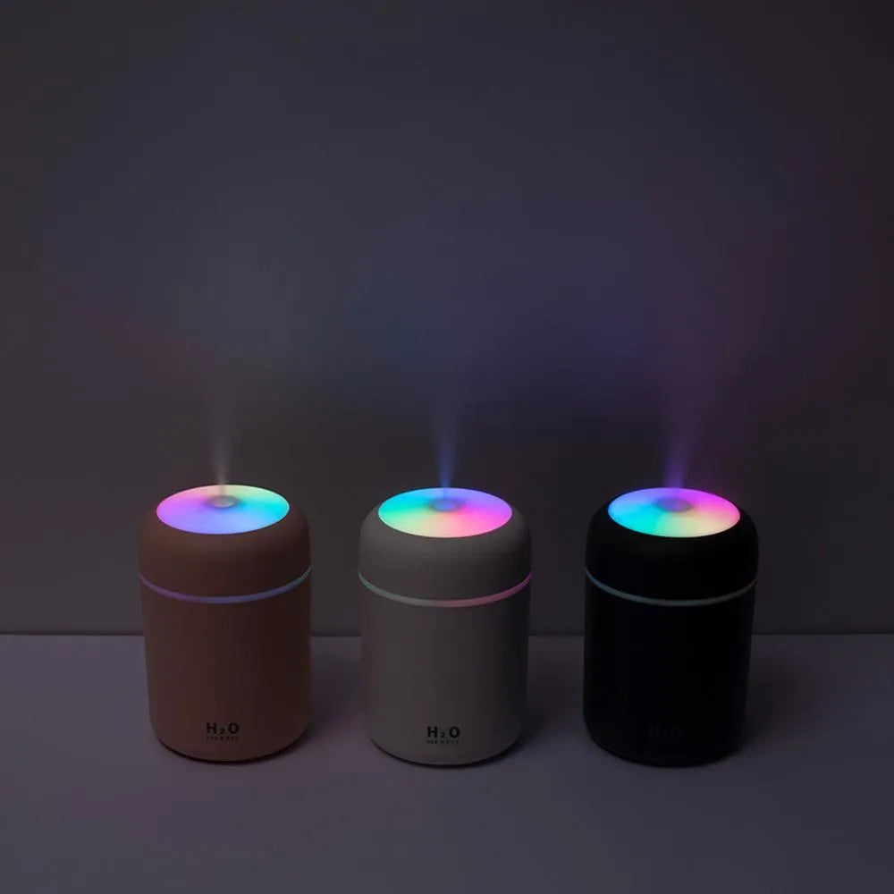 Car USB colourful cup air humidifier in pink with USB cord and water tank visible, compact design for cup holder use