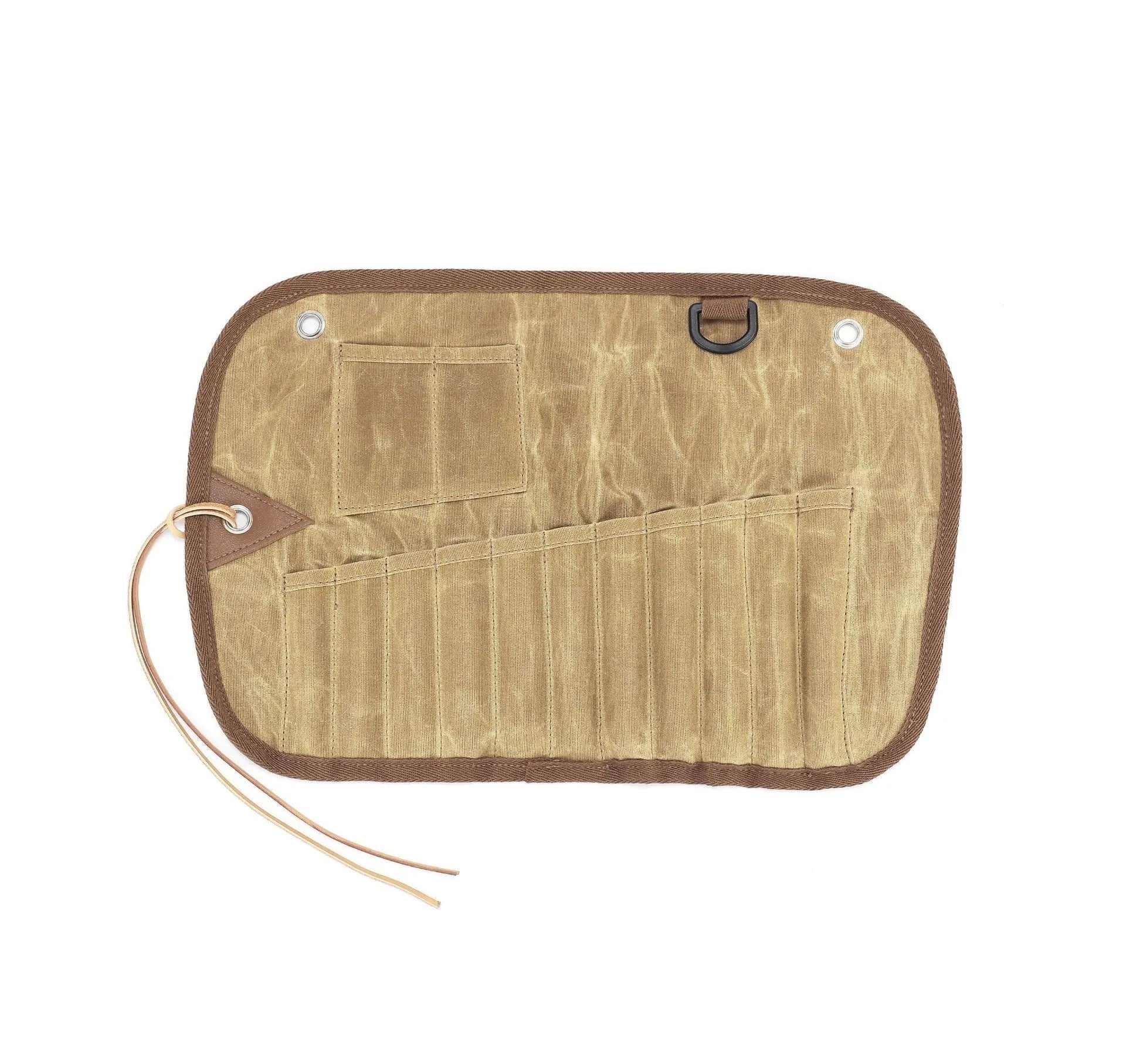 Green waxed canvas tableware storage bag containing wooden handle knives, forks, spoons, and chopsticks for outdoor use.