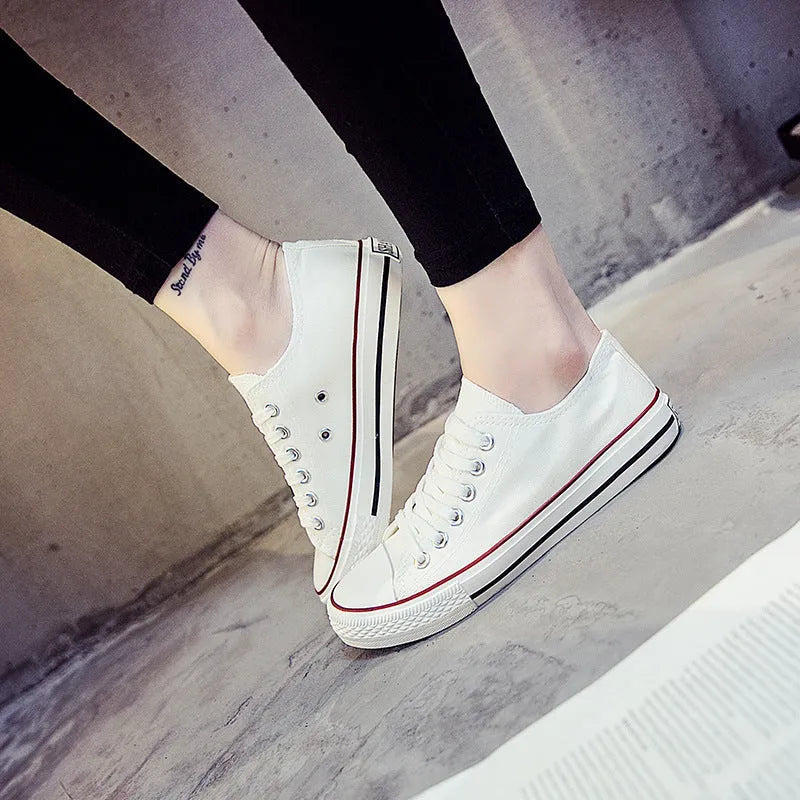 Women's solid colour canvas casual shoes shown in black, white black, white red, and all black options.