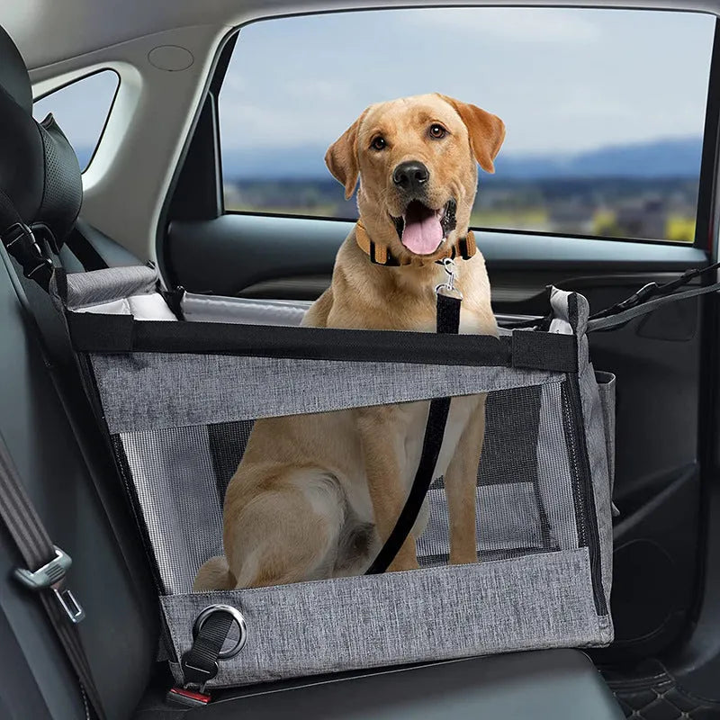 A black Oxford cloth soft-sided dog crate with mesh ventilation panels, shown next to a grey and a brown version.