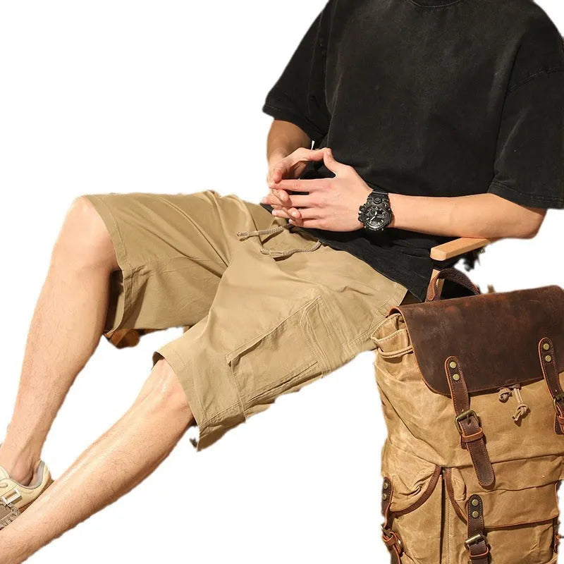 Loose cargo trousers in stretch cotton, fifth pants length, multi-pocket, available in gray, black, khaki, and Army Green