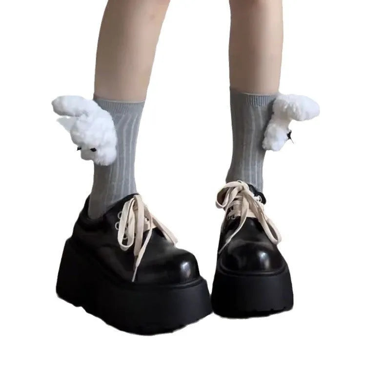 Matte black women's lace-up shoes with a chunky English muffin heel and thick rubber sole.