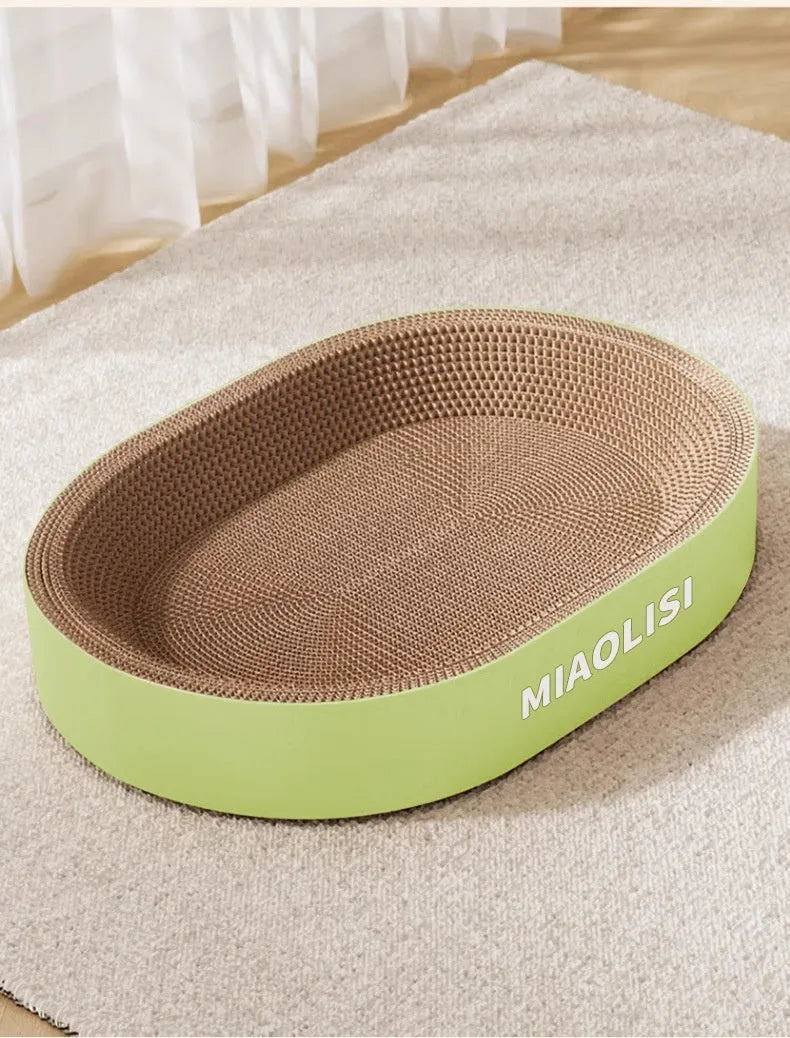 Green oval corrugated paper cat scratch board nest measuring 55cm in diameter