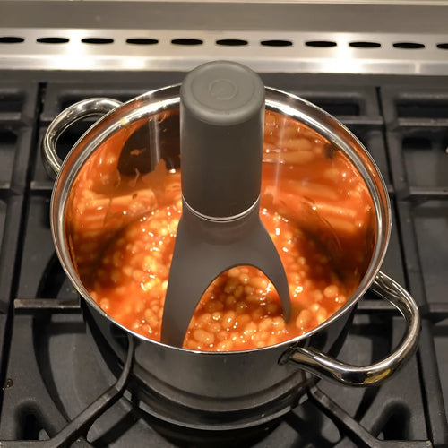 Green automatic cooking mixer utensil for sauces and soups with self-stirring design
