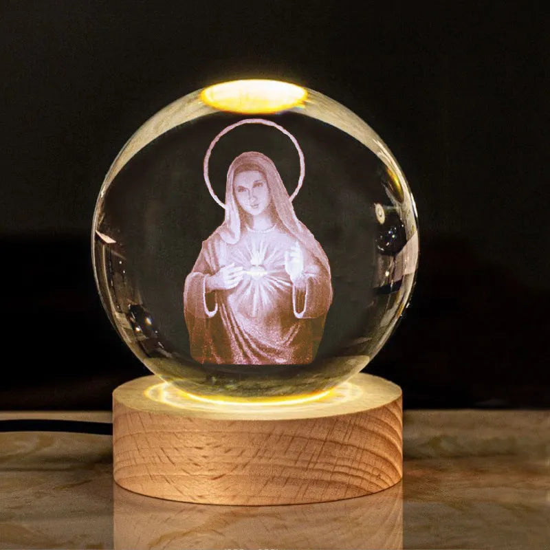 White crystal ball desk ornament with wood base and religious design inside