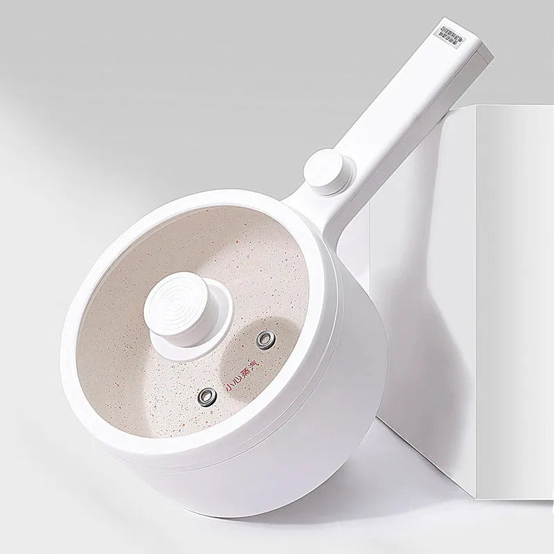 White and green multi-function electric cooking pot with control panel, 600W power, and compact design.