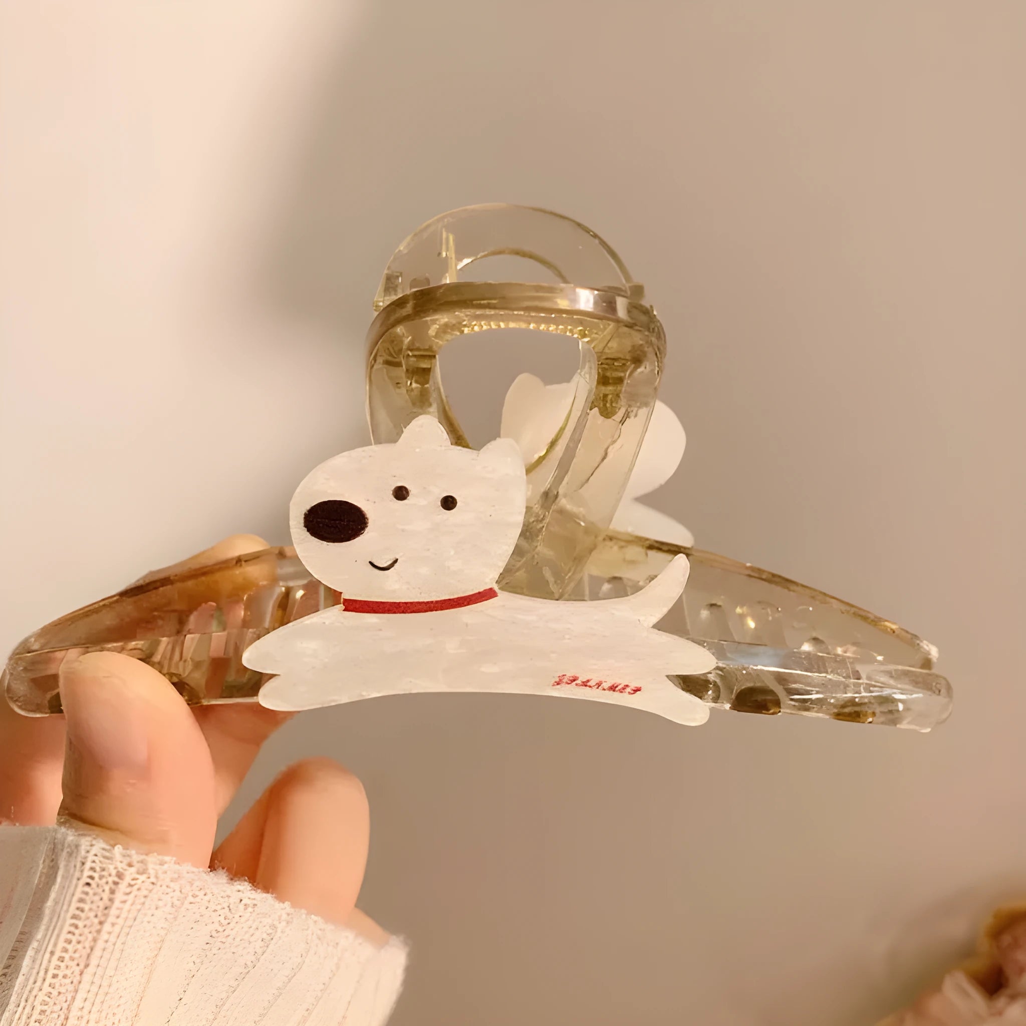 Cute cartoon puppy shaped hair barrettes with a grip clip, shown in beige and brown colours.