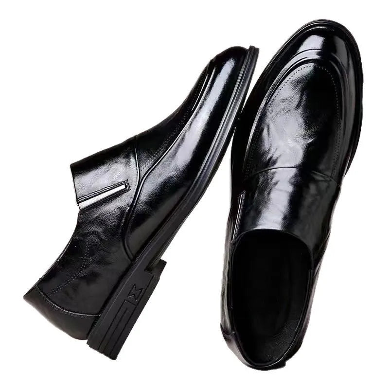 Men's black PU pointed toe slip-on formal shoes with rubber sole and metal detailing on a white background