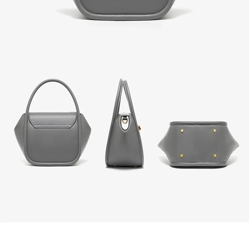 Wing shape cow leather cross-body handbag with buckle detail and fabric lining