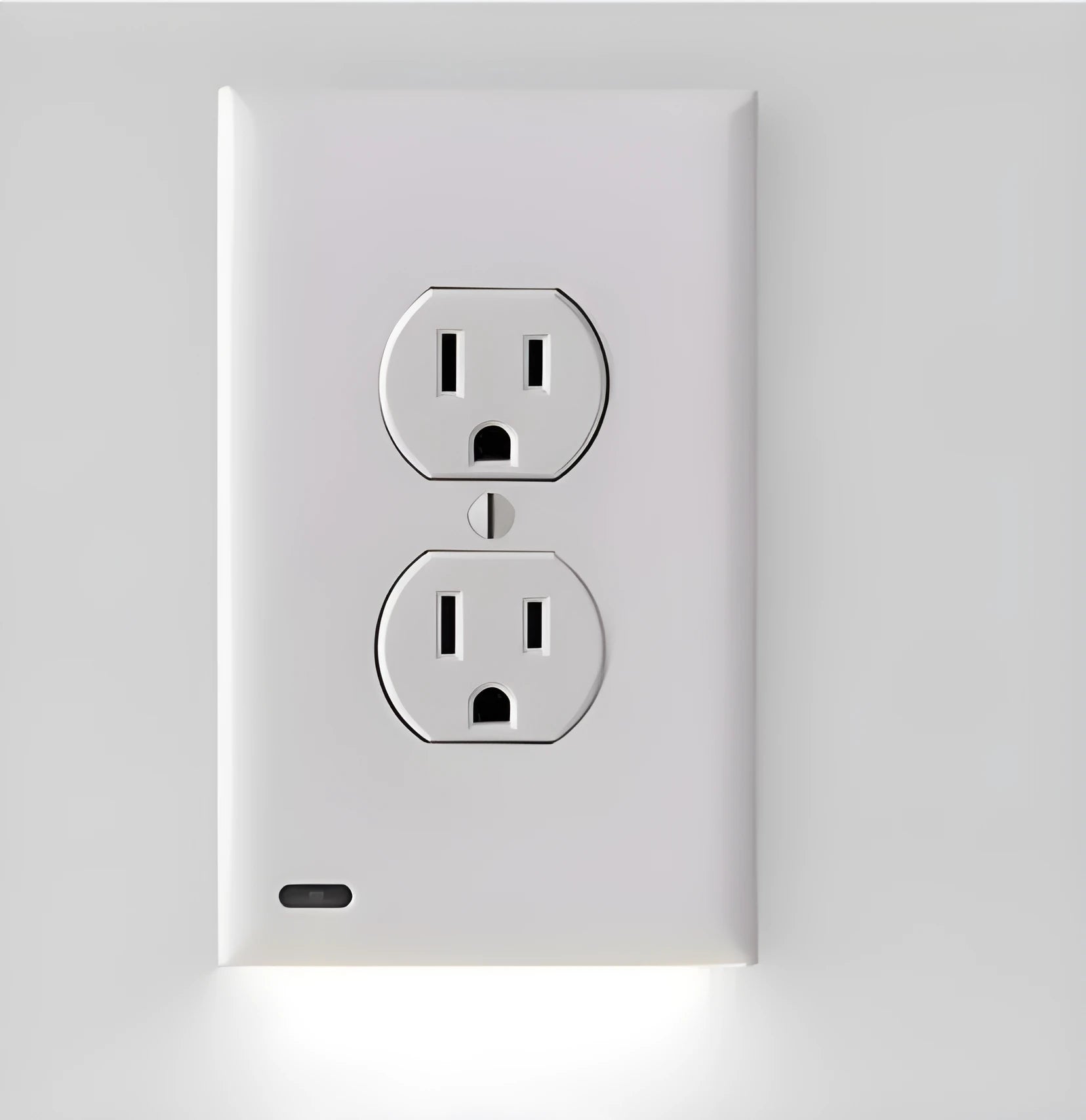 White automatic socket induction LED night light installed in a UK plug socket.