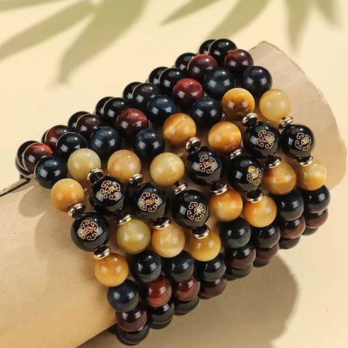 Handmade black agate beaded bracelet with Buddhist carving and tiger eye gemstones