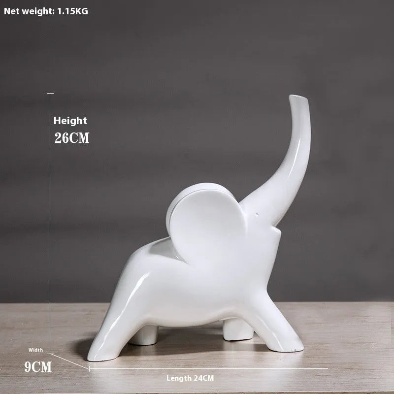 Modern resin elephant ornament in rose gold colour with raised trunk on display surface