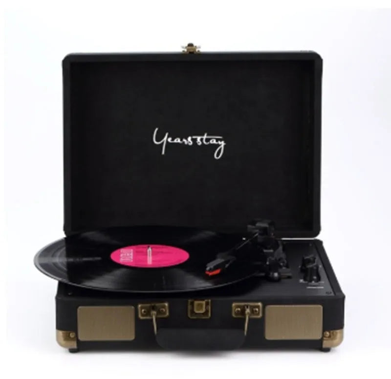 Leather-cased portable Bluetooth turntable for vinyl and film records in multiple colours.