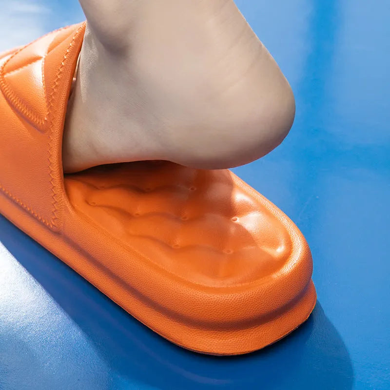 Pair of soft EVA non-slip bathroom slippers with a thick sole, shown in a choice of colours.