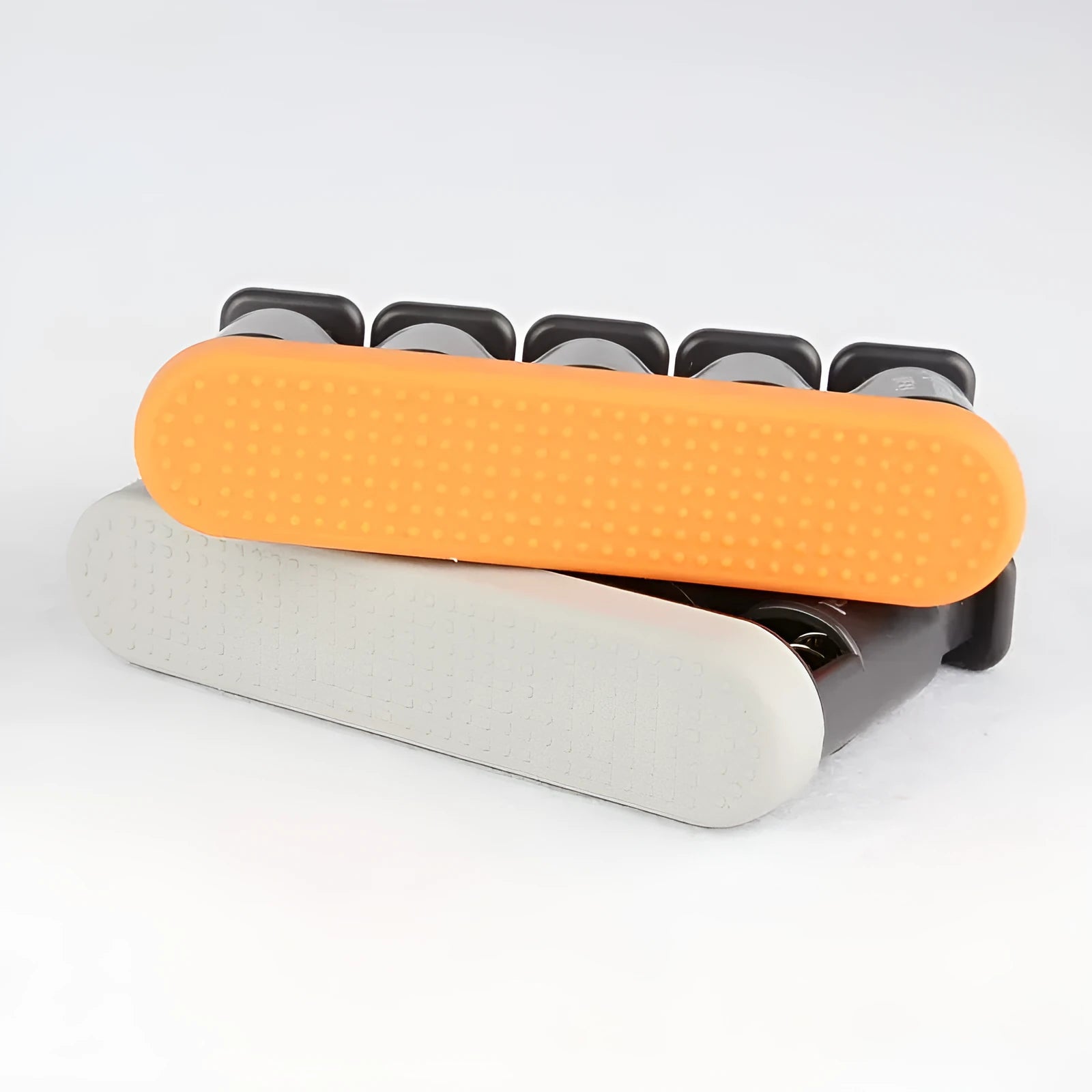 Grey or orange silicone finger trainer for hand muscle development