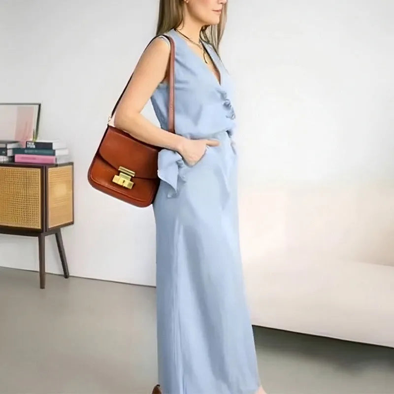 Women's white casual two-piece suit comprising a sleeveless vest and a long skirt on a hanger.