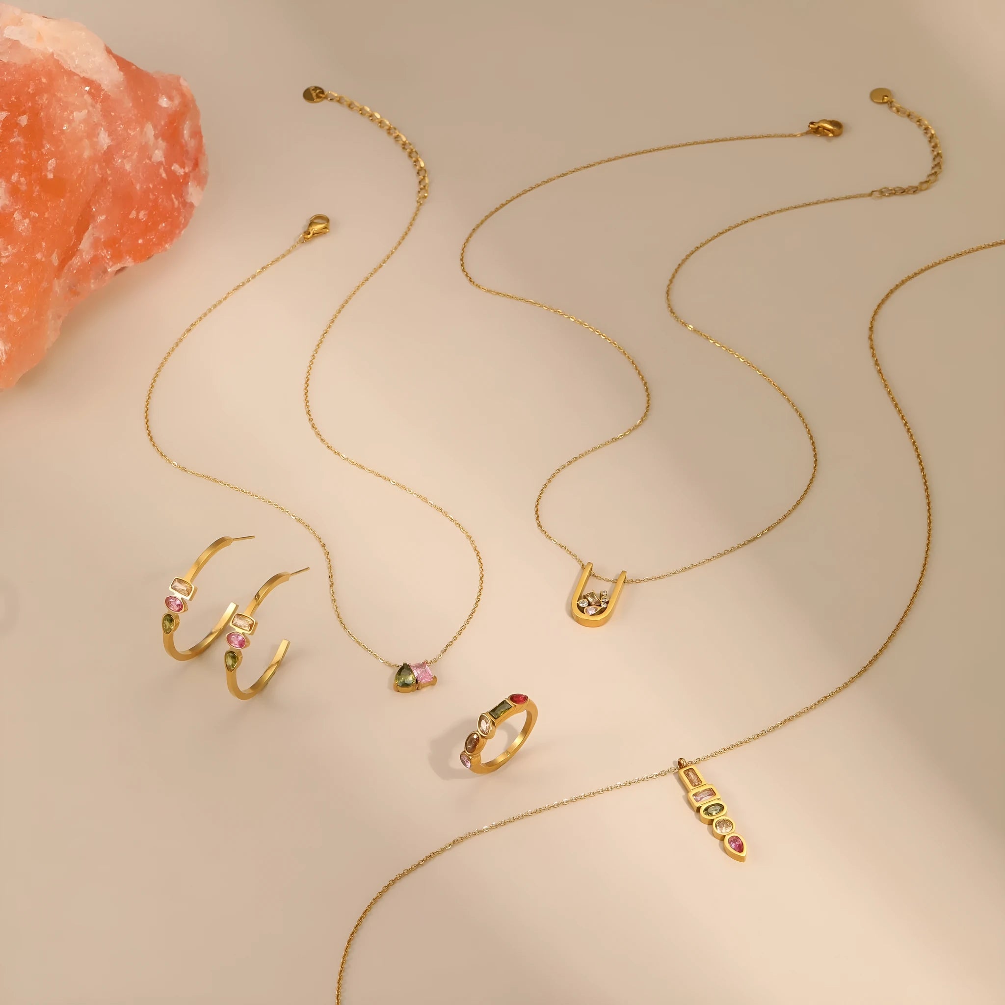 Geometric gold plated jewellery set with necklace, ring, and earrings featuring zircon elements