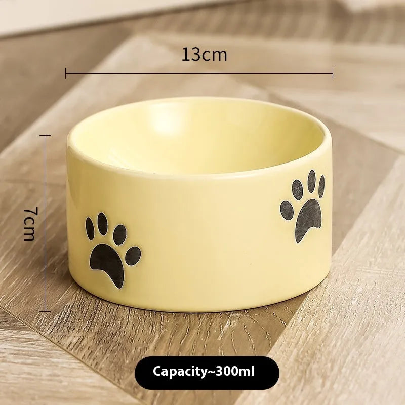 Ceramic cat bowl with high foot design in cat's paw pattern available in multiple colours