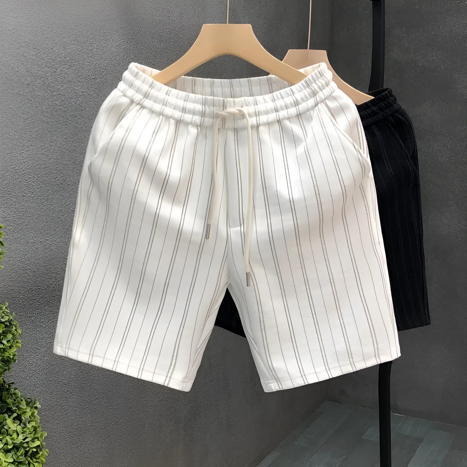 Men's black and white striped fleece-lined casual shorts with elastic waistband