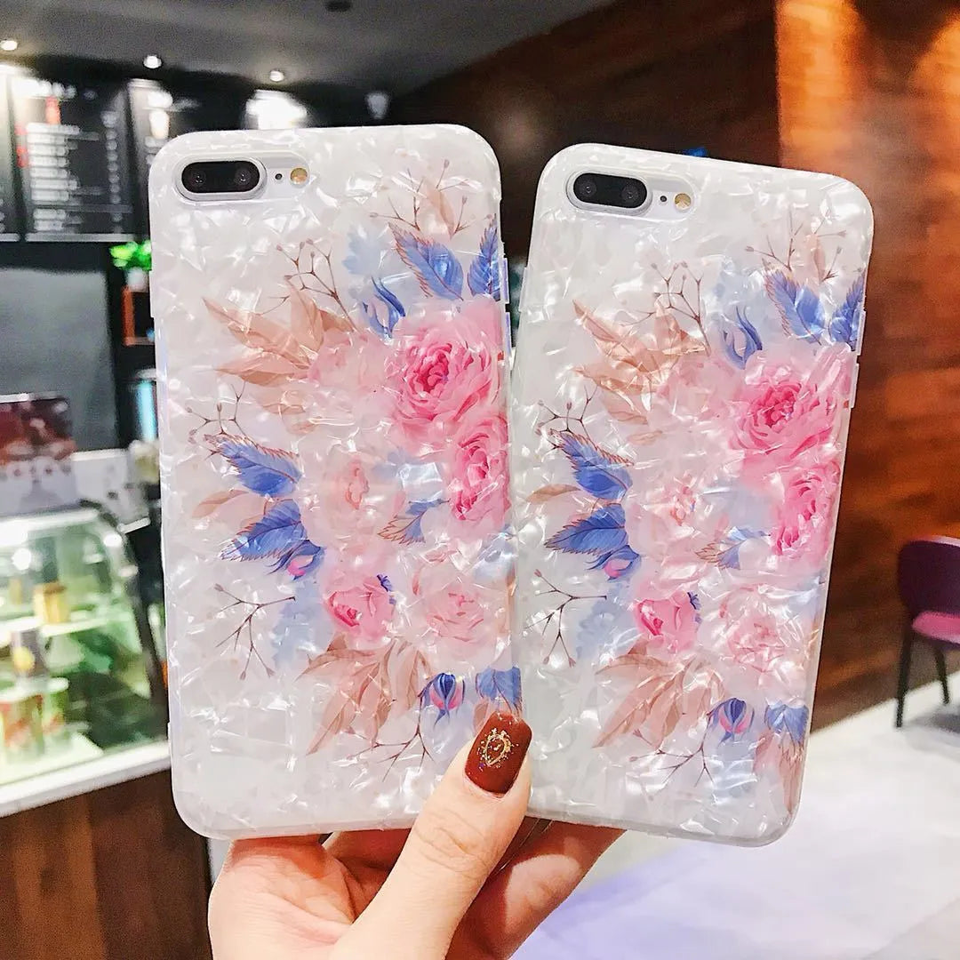 Dream Shell soft TPU iPhone case with rose flower pattern on back, shown in brown colour.