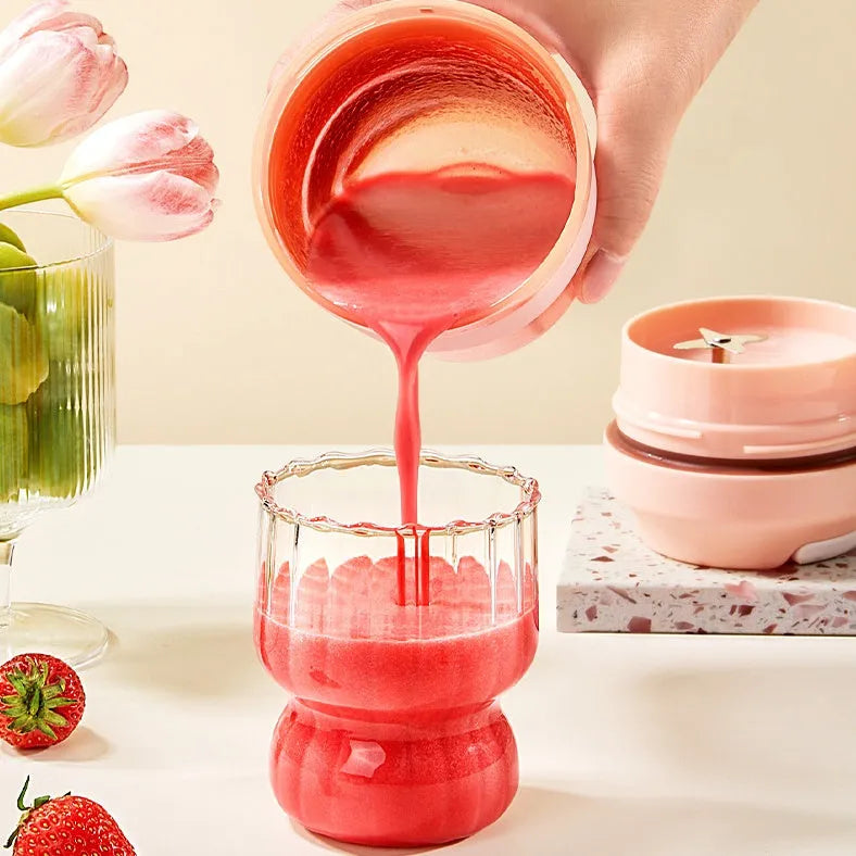 Grape purple portable rechargeable blender juicer cup with 400ml capacity and four stainless steel blades.