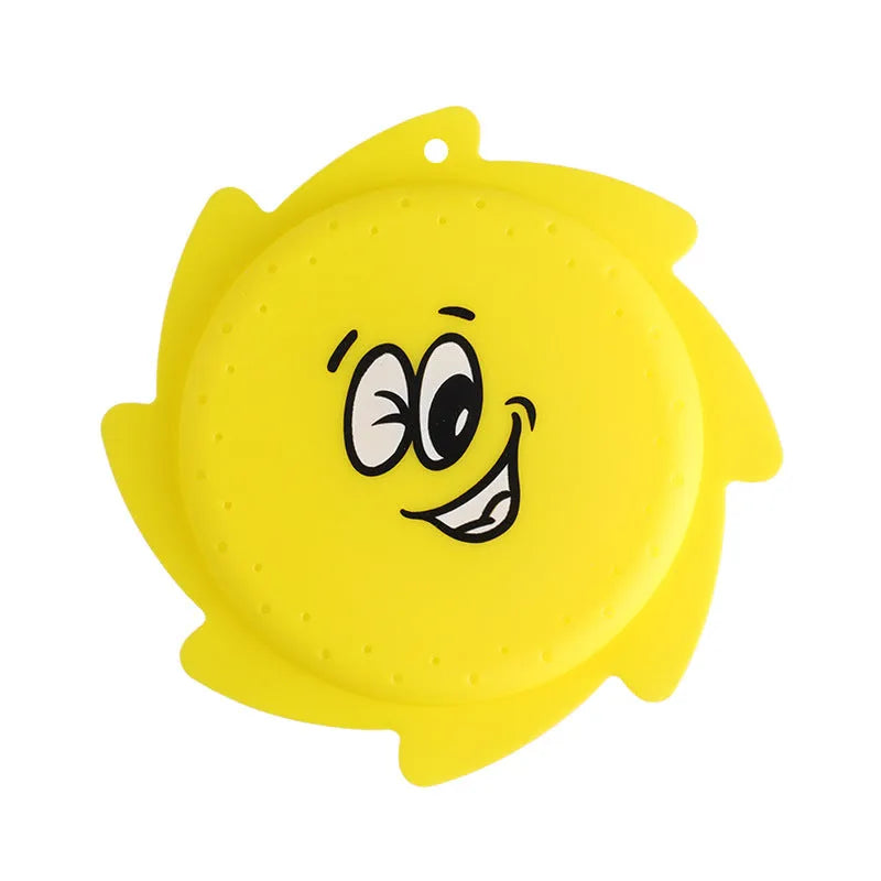 Silicone water toy in blue expression style on a wet surface for bath play
