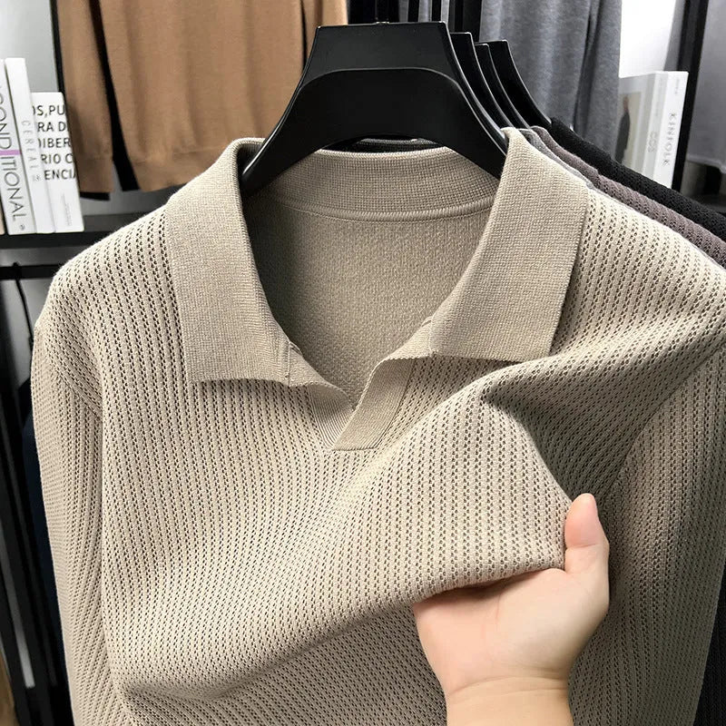 Men's loose fit casual green pullover sweater for autumn layering on a hanger.