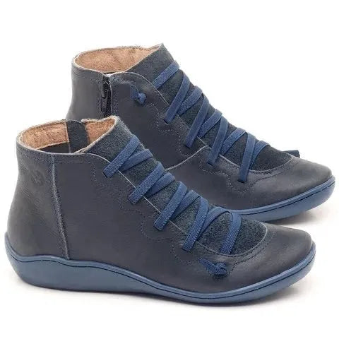 Women's black casual ankle booties with wedge heel and round toe on a rubber sole.