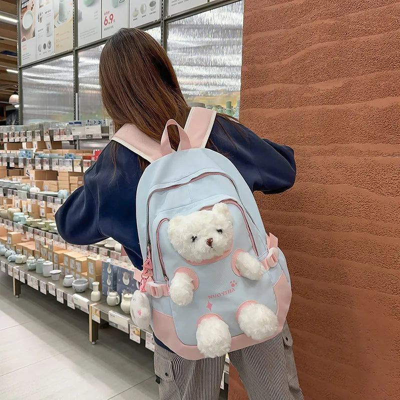 Nylon school backpack in macaron colours with curved shoulder straps and 20-35L capacity