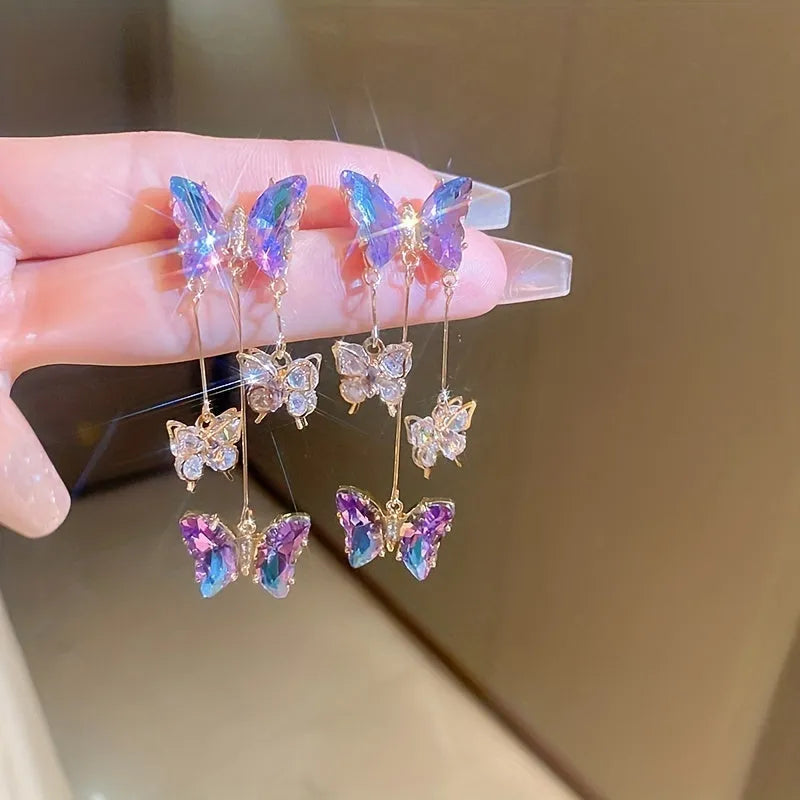 Silver needle crystal flowers butterfly tassel earrings with blue purple motifs and electroplated alloy construction