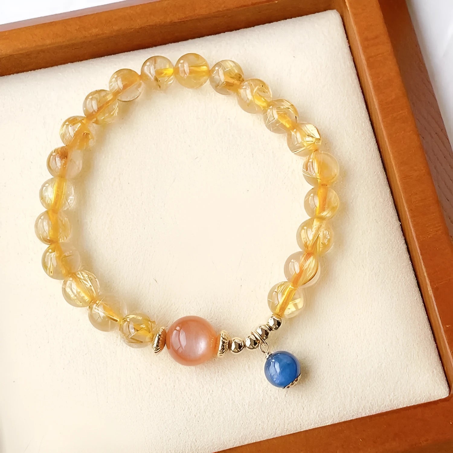 Women's gold rutilated quartz sunstone crystal bracelet with diamond beads