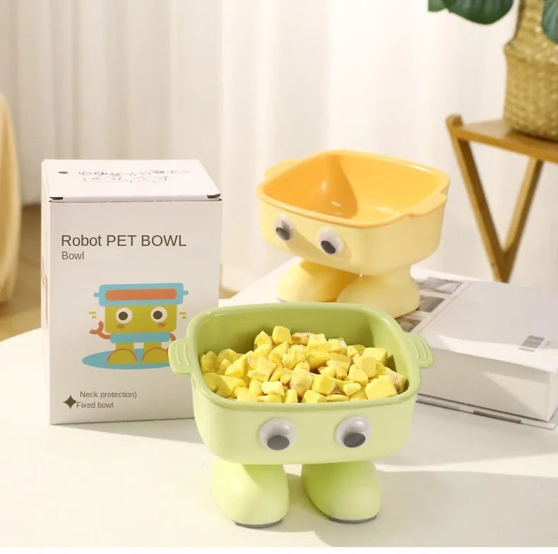 Green robot-shaped elevated cat bowl with tilted design and removable inner bowl on anti-slip base