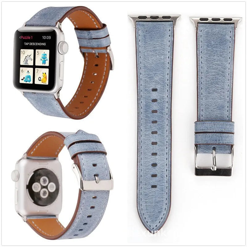 Blue leather watch strap with a silver folding buckle on a 42mm width watch case.