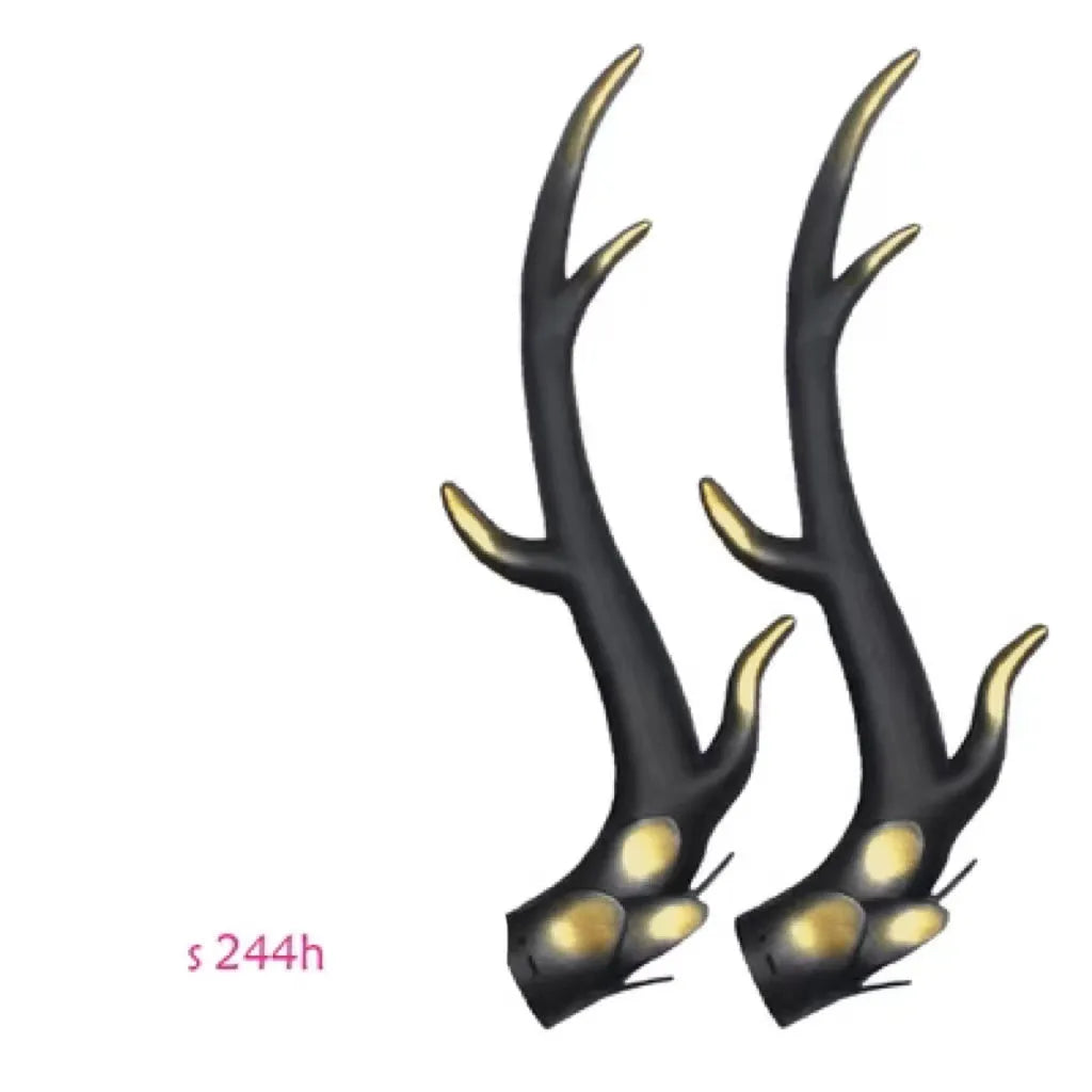A pair of resin dragon horn decorations for motorcycle helmets in black, shown next to a ruler for scale.