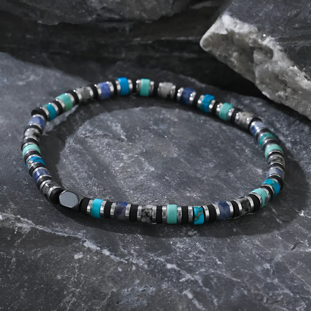 Hand-woven bohemian cylindrical bracelet with natural semi-precious stones in geometric arrangement