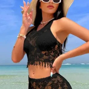 Women's two-piece bikini swimsuit with lace detail and attached tassel skirt cover-up in black or white