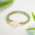 Handmade women's Hetian Jade Rabbit bracelet with glass rabbit charms in a gift box.